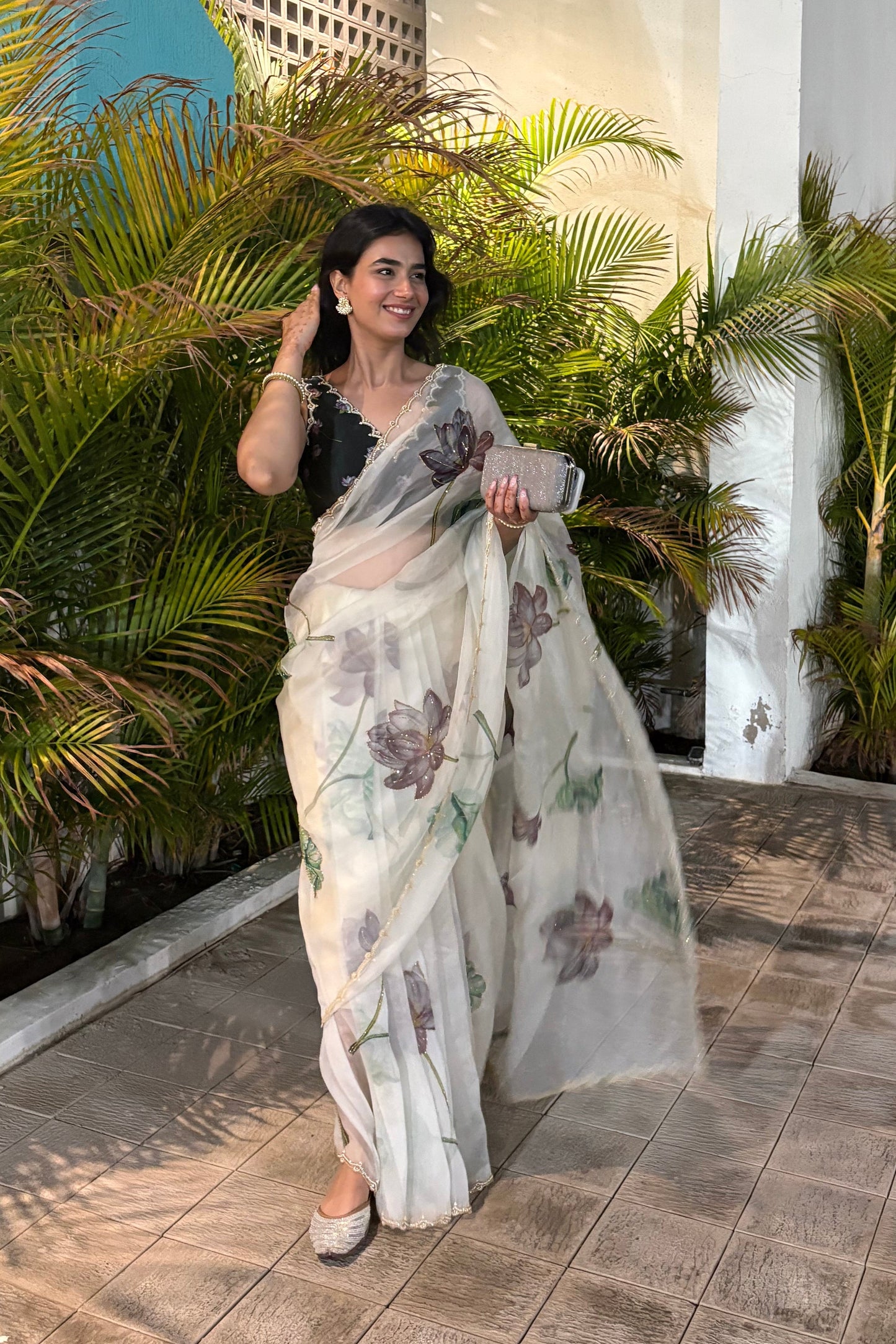 Fancy scalloped lace border design with golden detailing saree
