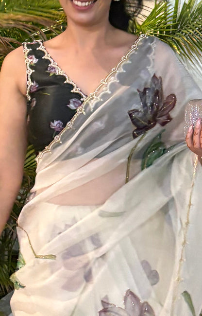 Fancy scalloped lace border design with golden detailing saree